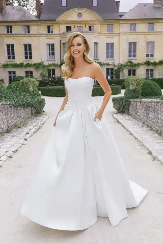 Model wearing a gown by Justin Alexander
