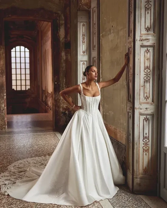 Model wearing a gown by Justin Alexander