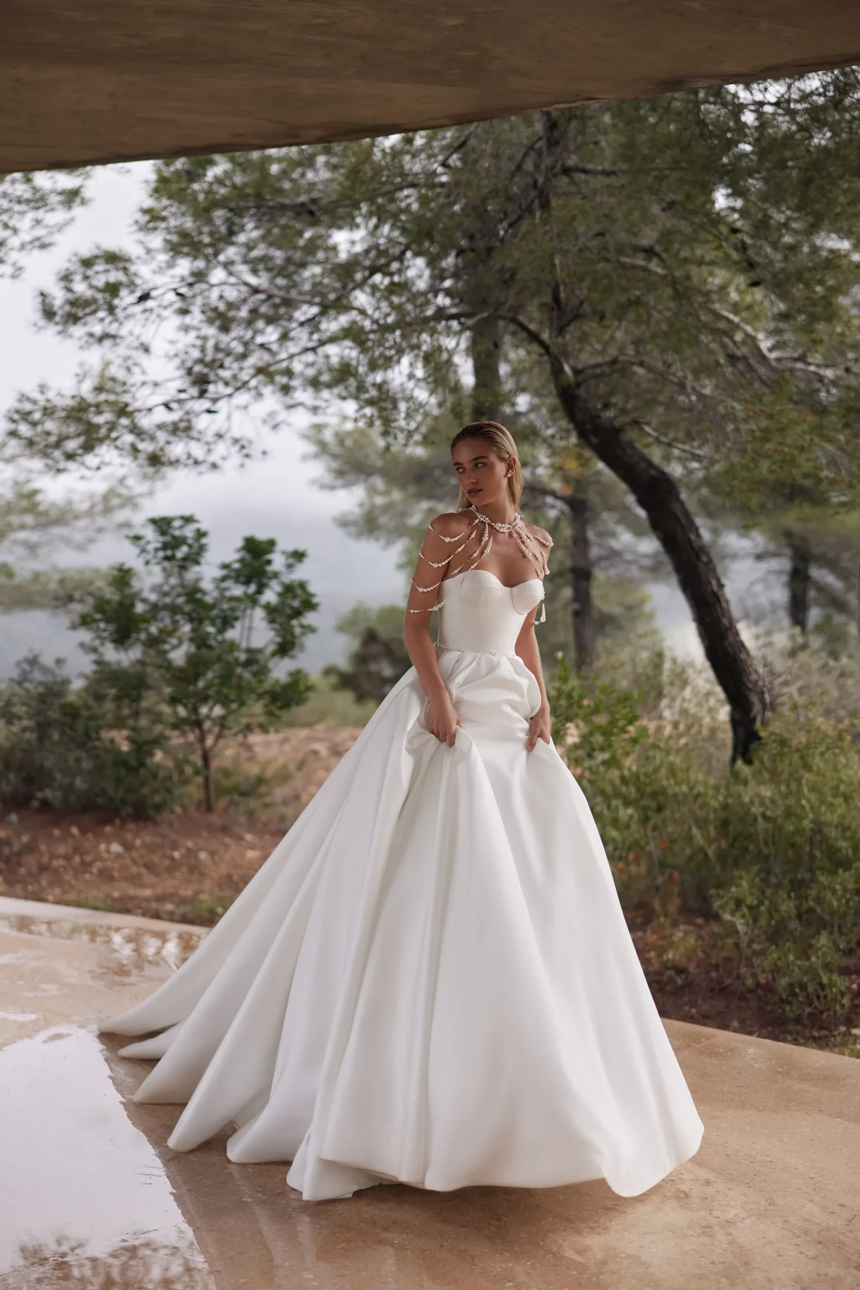 Model wearing a gown by Eva Lendel