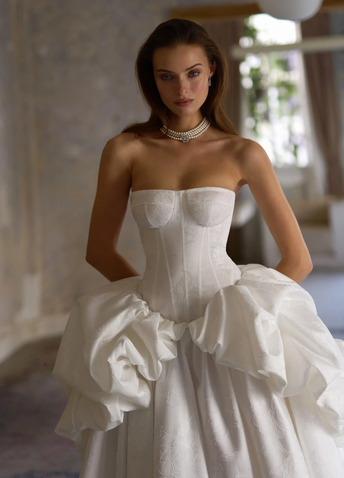 Model wearing a gown by Justin Alexander