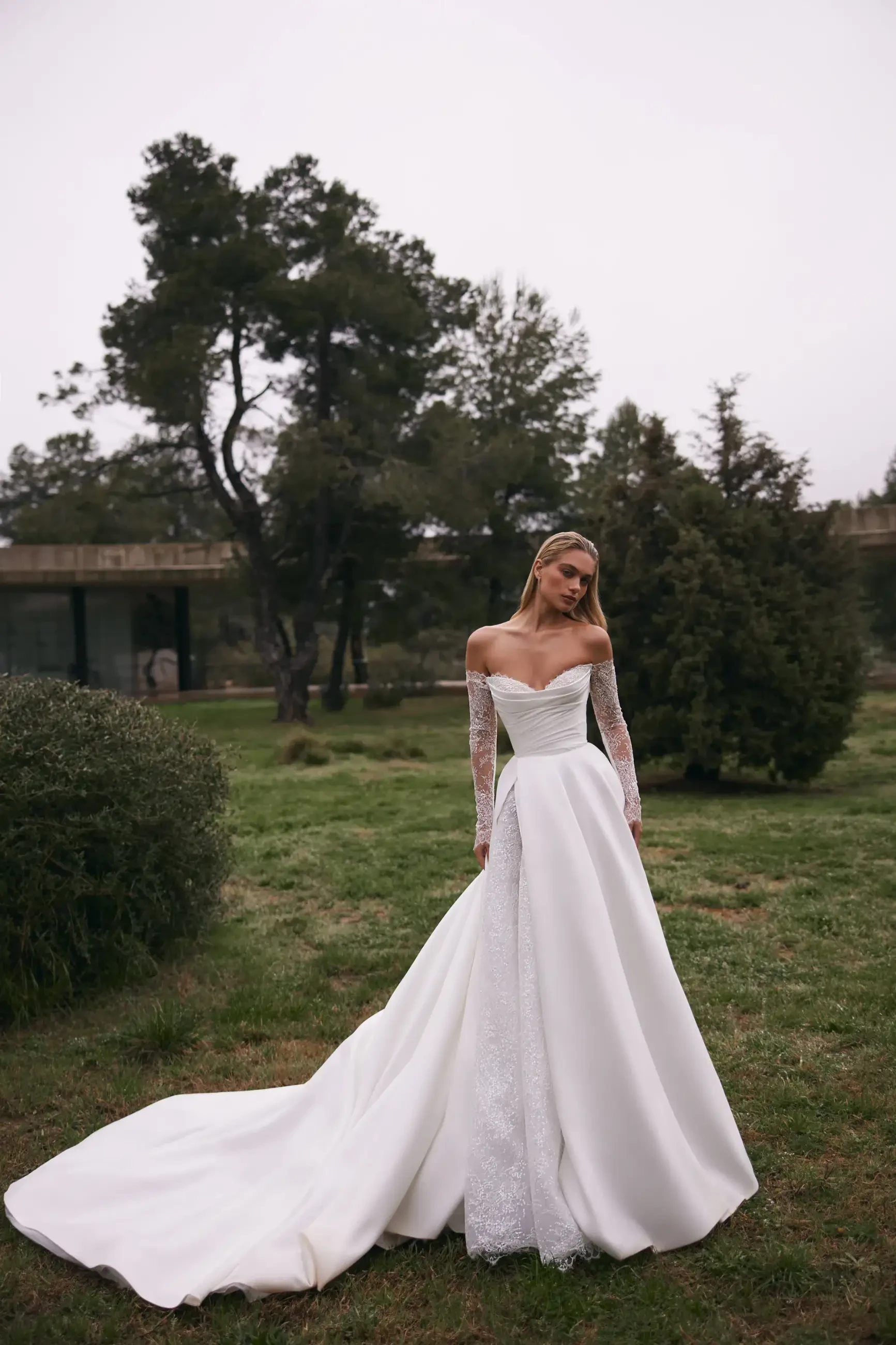 Model is wearing an a-line heart shaped neckline wedding gown