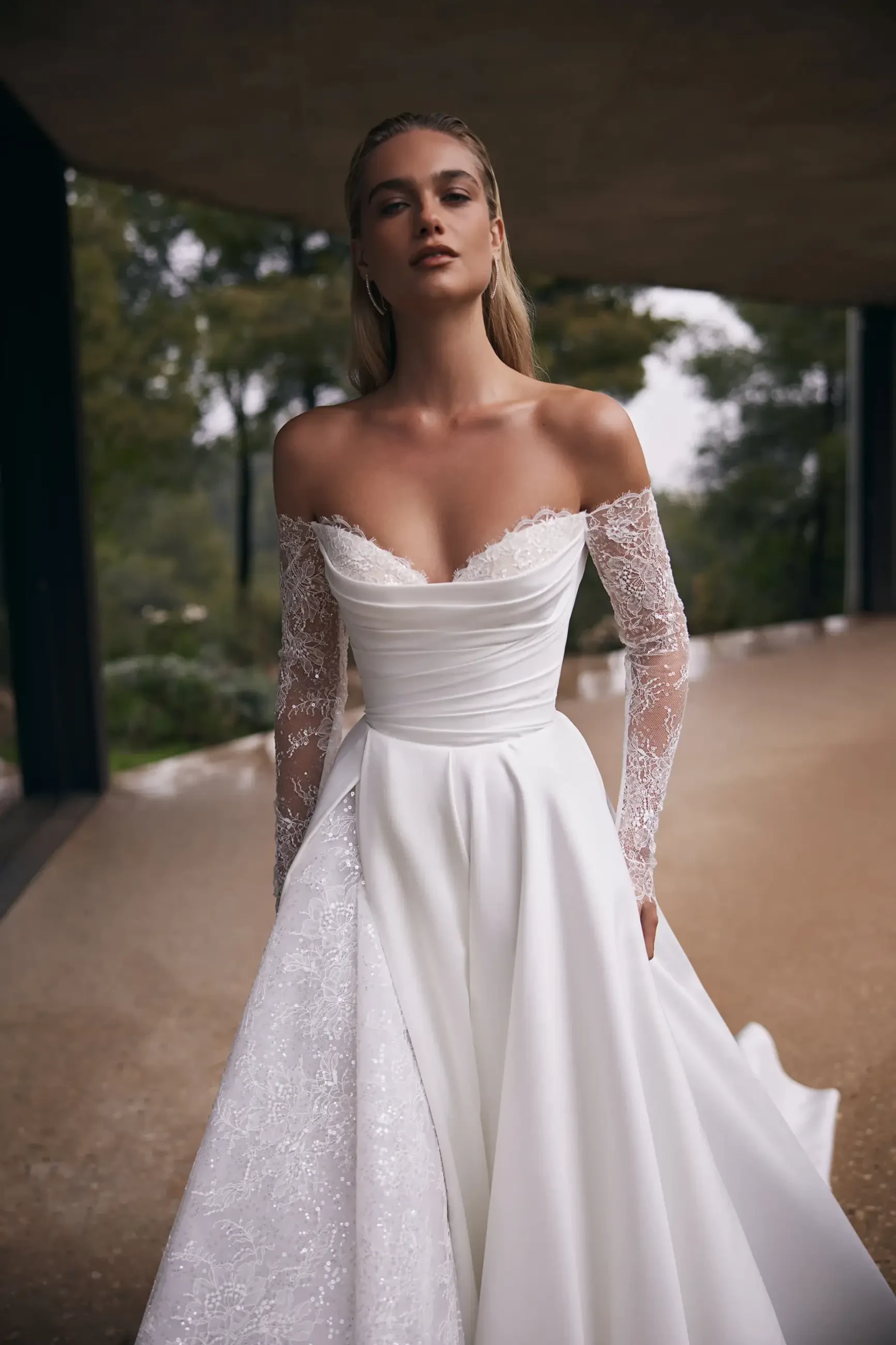 Model is wearing an a-line heart shaped neckline wedding gown
