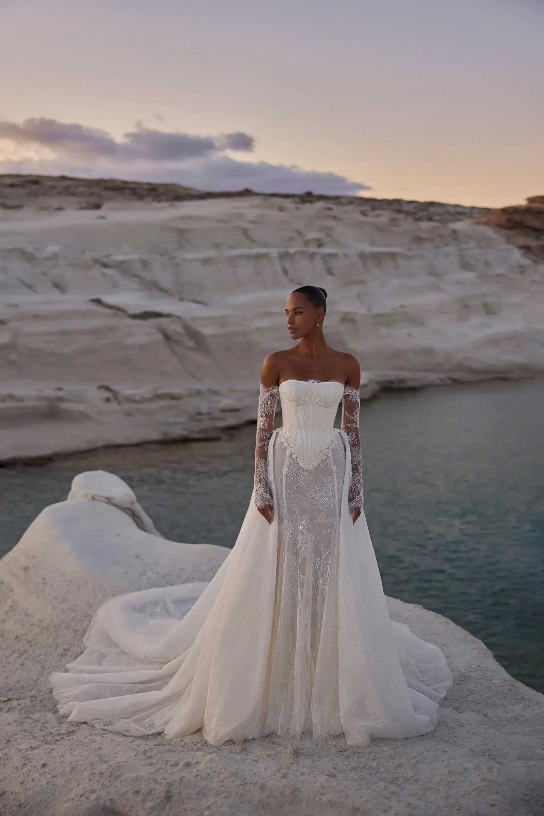 model is wearing a bold bridal gown by eva lendel with a fit and flare silhouette