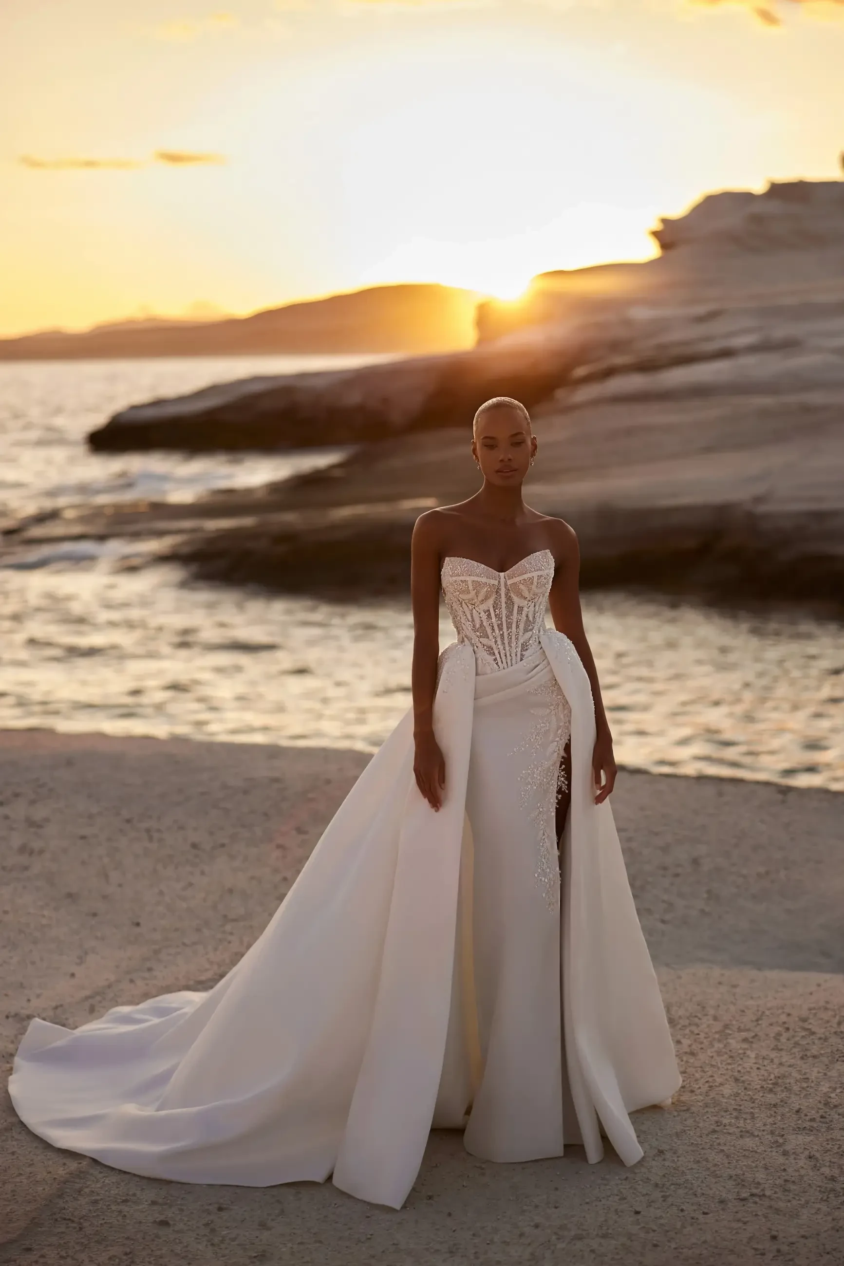 model is wearing a strapless ball gown wedding dress